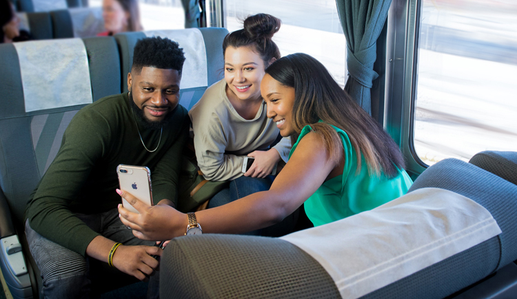 Passengers take a selfie on a train